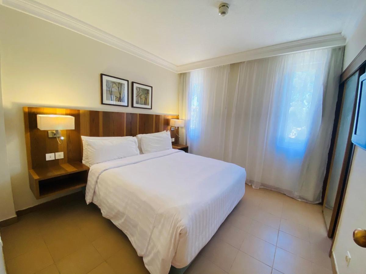 Hurghada Suites & Apartments Serviced By Marriott Zewnętrze zdjęcie A bedroom at the hotel